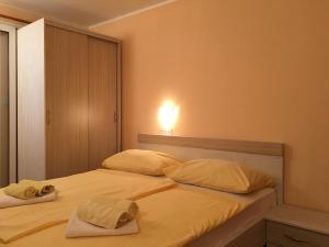 Postel nebo postele na pokoji v ubytování Guest House Sandra