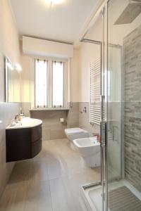 a bathroom with a sink and a toilet and a shower at Casa Lella in Novara +40 photos