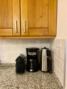 a coffeemaker and a coffee maker on a kitchen counter at Sunset House in Selçuk