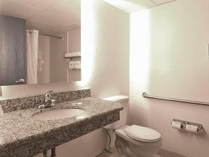a bathroom with a sink and a toilet at Quality Inn & Suites Everett in Everett
