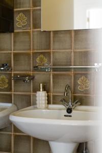 a bathroom with a sink and a mirror at Spacious Apartment at Top Location Grote Markt in Sint-Niklaas +10 photos
