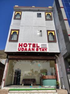 a hotel uzbekistanstay sign in front of a building at Hotel Udaan Stay in Jaipur
