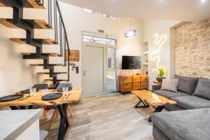 a living room with a couch and a table at Corfu nest apartment in Ágios Rókkos