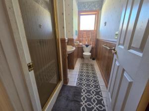 a small bathroom with a toilet and a sink at Mrs Hippie Inn in Alma +29 photos