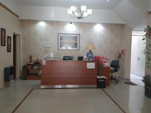 a lobby with a reception desk in a hospital at San Carlos Hotel in Buenos Aires