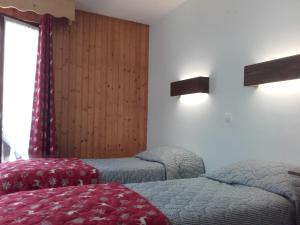 Postel nebo postele na pokoji v ubytování Hôtel Le Mont Jorat