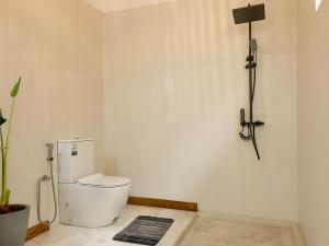 a bathroom with a toilet in a room at Hide Boutique Villas in Weligama +44 photos