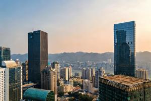a view of a city with skyscrapers at Chongqing IBESHO HOTEL in Chongqing