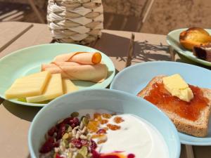 a table with three bowls of food on plates at ibis budget Marseille Aeroport Provence in Marignane