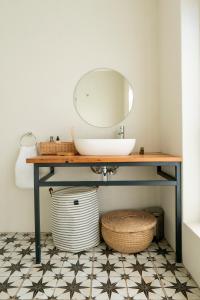 a bathroom with a sink and a mirror at The Dunes Pringle Bay in Pringle Bay +41 photos