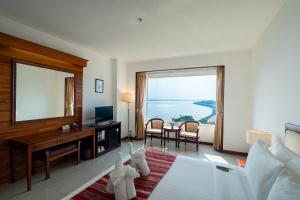 a hotel room with a view of the ocean at Champasak Grand Hotel in Pakse