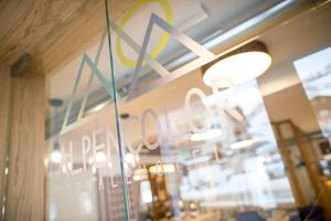 a store window with a sign for a restaurant at Alpencolor Hotel Tonale in Passo del Tonale
