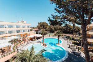 an image of a swimming pool at a hotel at Sagitario Playa in Cala Blanca