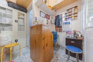 a room with two chairs and a desk and two stools at Adam Guesthouse Mitra RedDoorz in Bogor