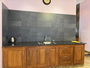 a kitchen with a sink and a counter at Bella Casa in Vagamon +56 photos
