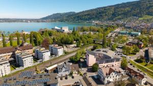 an aerial view of a town next to a lake at Sonnenblick Bregenz in Bregenz