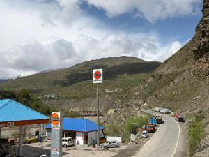 a gas station on the side of a mountain at Hotel Devachan & Restaurant in Tāndi
