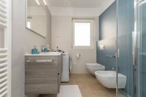 a bathroom with a sink and a toilet and a shower at Al Col de Foia in Agordo +17 photos