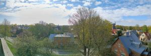 an overhead view of a town with a tree and buildings at Uueka Külaliskorter in Kuressaare