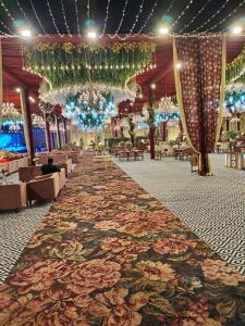 a large room with a large rug on the floor at Palmdale Hotel & Resort in Ambāla