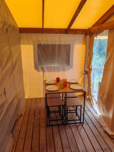a room with a table and chairs in a tent at Yachting lodge 83 in Sanary-sur-Mer +25 photos