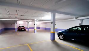 a parking garage with a car parked in it at Plaza de la Luz Cádiz in Cádiz