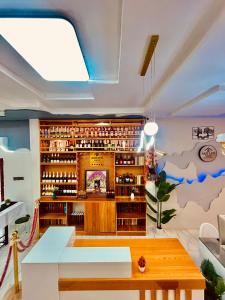 a living room with a ceiling with a whale mural at Akrafthaus by KAVKANZ in Abuja