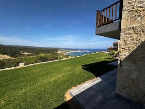 a view of the ocean from a house at Golden Hill Hotel in Rizokarpaso
