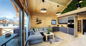 a living room and kitchen in a tiny house at Vila Valentina Luxury Chalet in High Tatras in Veľká Lomnica