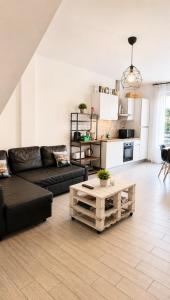 a living room with a couch and a coffee table at Celeste's House in Florence