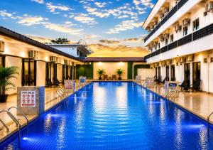 a swimming pool in the middle of a building at Paradise Resort Langkawi in Pantai Cenang