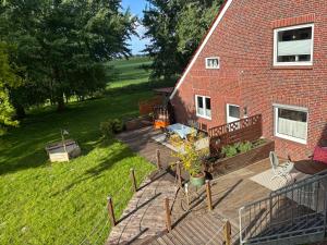 an aerial view of a house with a deck at Ferienhof Harlenest in Wittmund