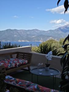 a table and chairs on a balcony with a view at A Casa di Minana in Piana +7 photos