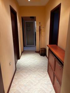 a hallway of a home with a hallway at Голям двустаен апартамент in Burgas