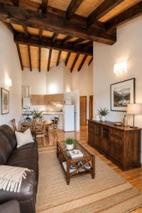 a living room with a couch and a table at Apartamento La Castañera in Colombres