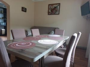 a dining room table with a rangoli on it at Yaremche Potik Guest House in Yaremche