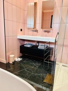 a bathroom with a sink and a mirror at Villa premium avec extérieur ensoleillé in Urrugne +24 photos