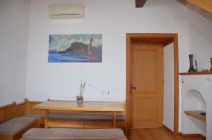 a room with a table and a painting on the wall at Villa Historyka in Alanya +5 photos