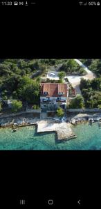 an aerial view of a house in the water at Spansa in Drvenik Veli