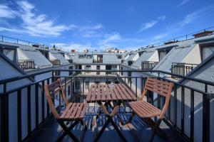 a table and chairs sitting on a balcony at Budapest Center Residence in Budapest