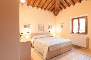 a bedroom with a bed and a window at TUSCANFLAT Castle in Scrofiano +214 photos