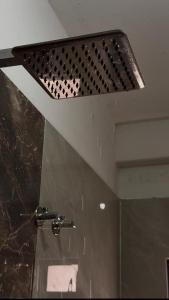 a bathroom with a shower with a shower head at Nasa in Panchanai