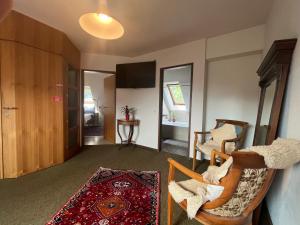 a living room with a couch and a table at Villa Pdorf in Perchtoldsdorf