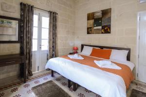מיטה או מיטות בחדר ב-Casa Lapira