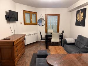 a living room with a couch and a table at Le Magnifique 3 personnes Drancy in Drancy