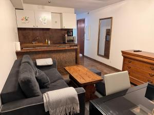 a living room with a couch and a table at Le Magnifique 3 personnes Drancy in Drancy