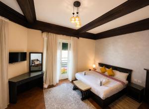 a bedroom with a large bed and a window at Cairo Dream Boutique Hotel in Cairo