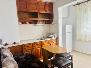 a small kitchen with a table and a sink at KA Home in Petrich