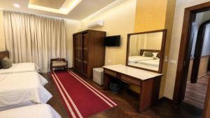 a hotel room with a mirror and a bed at Cairo Dream Boutique Hotel in Cairo +30 photos