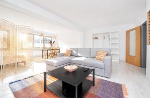 a living room with a couch and a table at Grand Rue Studio - sleeps 5 in Luxembourg